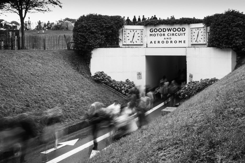 The tunnel under the racing track at Goodwood, with people passing through it.